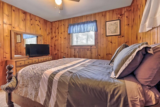 1119 Gross Rd, Woodruff, WI 54568 - bedroom featuring wooden walls and a ceiling fan