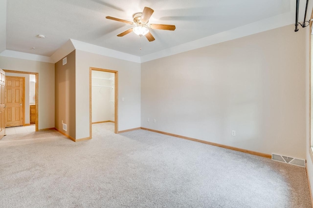 7942 Williamsburg Ct Unit 101, Bristol, WI 53104 - empty room featuring a ceiling fan and light carpet