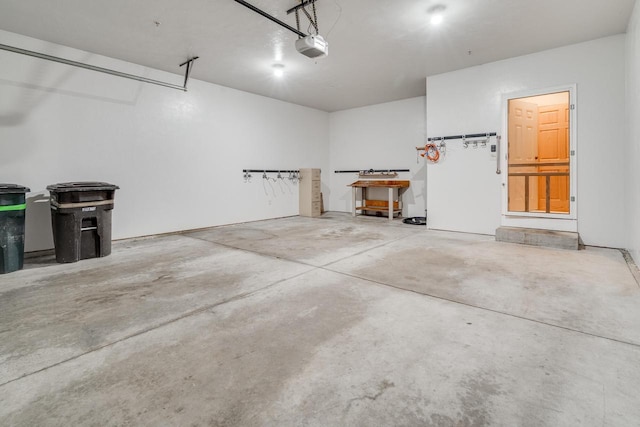 7942 Williamsburg Ct Unit 101, Bristol, WI 53104 - garage featuring a garage door opener