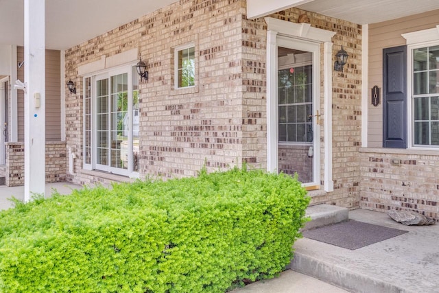 7942 Williamsburg Ct Unit 101, Bristol, WI 53104 - property entrance featuring a porch and brick siding