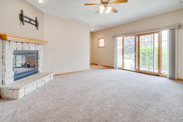7942 Williamsburg Ct Unit 101, Bristol, WI 53104 - unfurnished living room featuring carpet flooring, ceiling fan, a fireplace, and recessed lighting