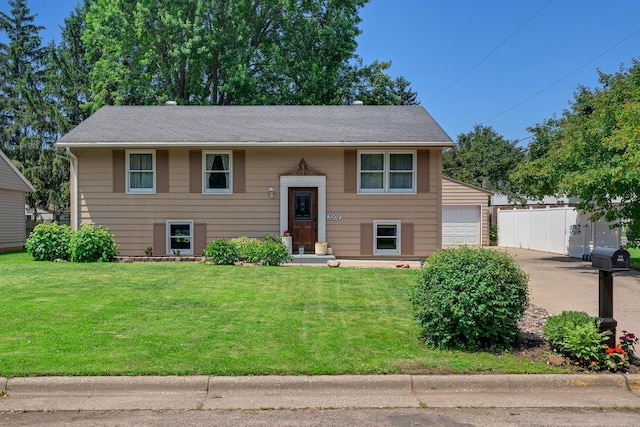3202 34th St, South Street, La Crosse, WI 54601 - raised ranch with a garage and concrete driveway