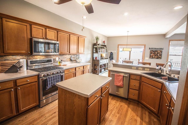 120 Wind Sail Ct, Random Lake, WI 53075 - kitchen featuring stainless steel appliances, decorative backsplash, a ceiling fan, light wood-type flooring, and recessed lighting