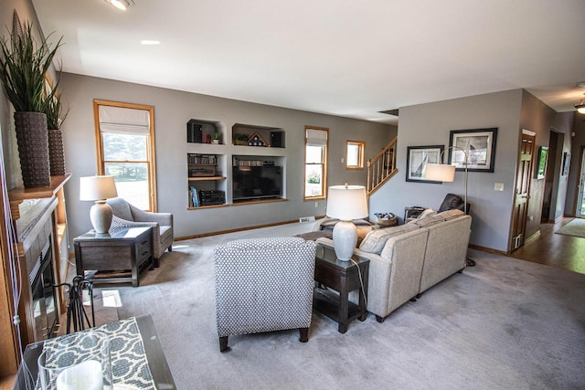 120 Wind Sail Ct, Random Lake, WI 53075 - living area featuring carpet, stairs, and plenty of natural light