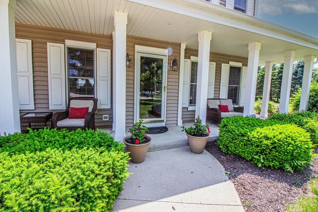 120 Wind Sail Ct, Random Lake, WI 53075 - view of exterior entry featuring covered porch