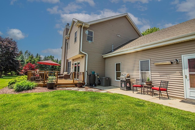 120 Wind Sail Ct, Random Lake, WI 53075 - back of house featuring a deck, a lawn, a patio, and roof with shingles