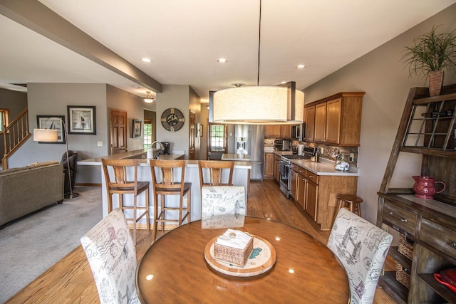 120 Wind Sail Ct, Random Lake, WI 53075 - dining area with recessed lighting and stairs