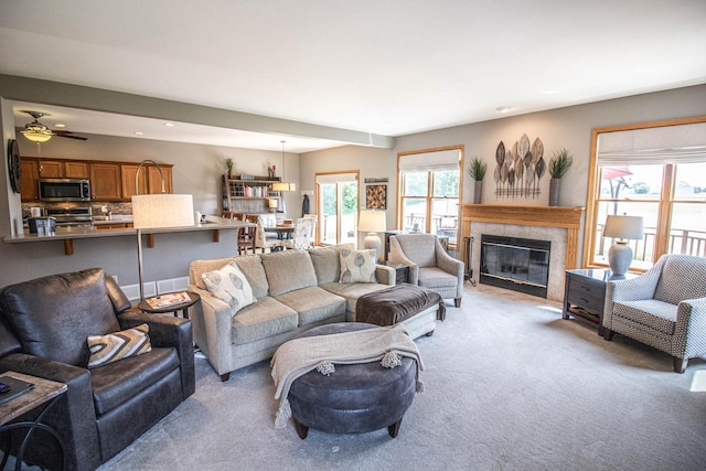 120 Wind Sail Ct, Random Lake, WI 53075 - living area featuring light colored carpet, a fireplace, ceiling fan, and recessed lighting
