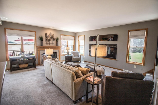 120 Wind Sail Ct, Random Lake, WI 53075 - carpeted living room with plenty of natural light and a glass covered fireplace