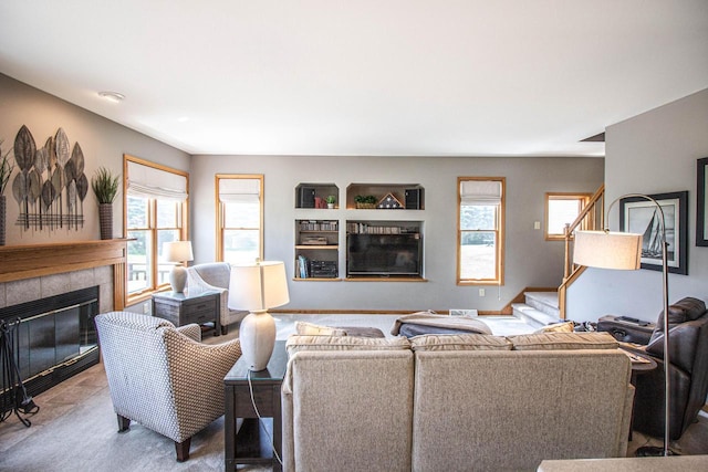 120 Wind Sail Ct, Random Lake, WI 53075 - living area featuring a tile fireplace and stairway