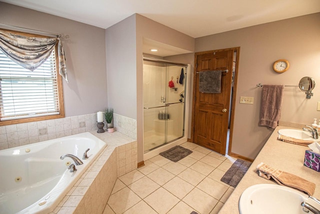 120 Wind Sail Ct, Random Lake, WI 53075 - bathroom with double vanity, a jetted tub, a stall shower, and tile patterned flooring
