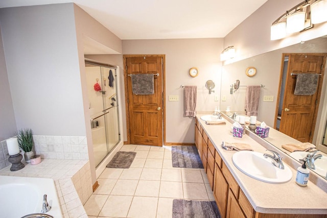 120 Wind Sail Ct, Random Lake, WI 53075 - bathroom featuring double vanity, a stall shower, a bath, and tile patterned flooring