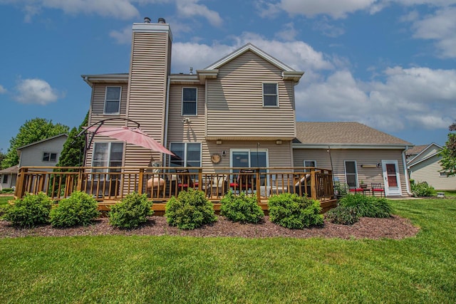 120 Wind Sail Ct, Random Lake, WI 53075 - rear view of property with a chimney, a wooden deck, and a yard