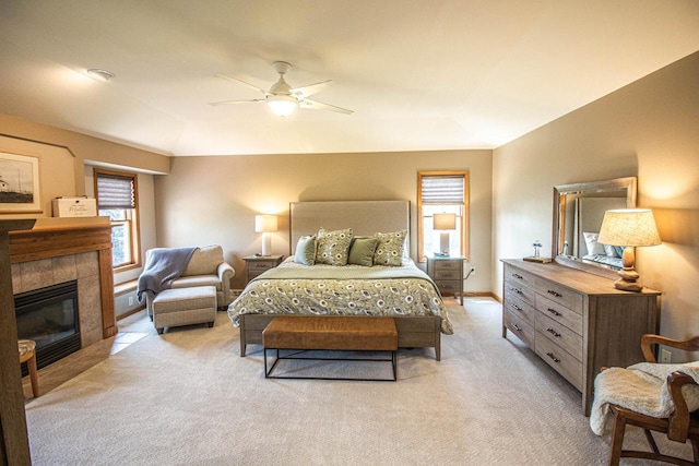 120 Wind Sail Ct, Random Lake, WI 53075 - bedroom featuring light colored carpet, a tiled fireplace, and a ceiling fan