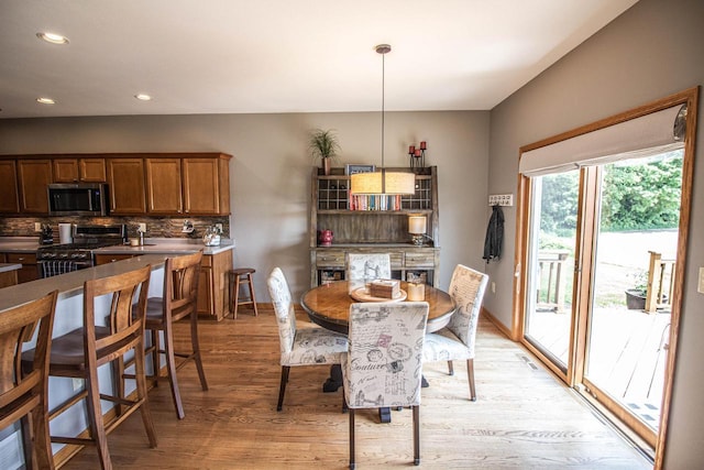 120 Wind Sail Ct, Random Lake, WI 53075 - dining space featuring light wood-style flooring and recessed lighting