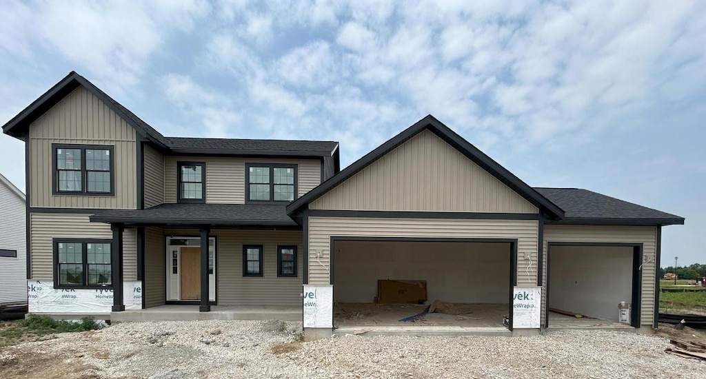 1750 Hammock Ln, Oconomowoc, WI 53066 - view of front of home with a porch and an attached garage
