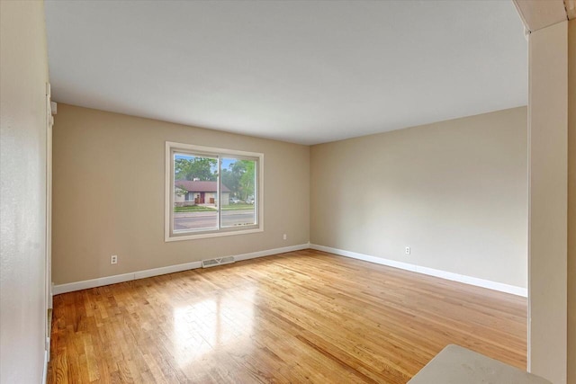 3918 W Hampton Ave, Milwaukee, WI 53209 - spare room featuring baseboards and wood finished floors