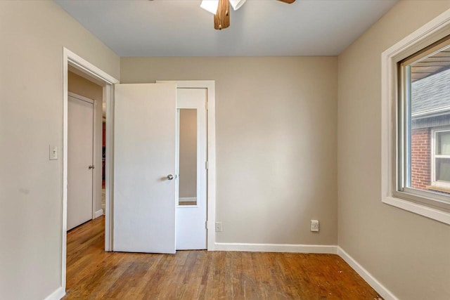 3918 W Hampton Ave, Milwaukee, WI 53209 - unfurnished bedroom with wood finished floors and a ceiling fan