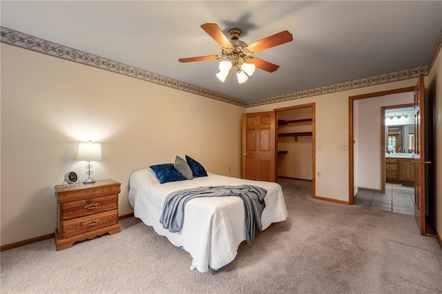 3413 Mcelroy Ct, Eau Claire, WI 54701 - bedroom with light colored carpet, a closet, ceiling fan, and a walk in closet