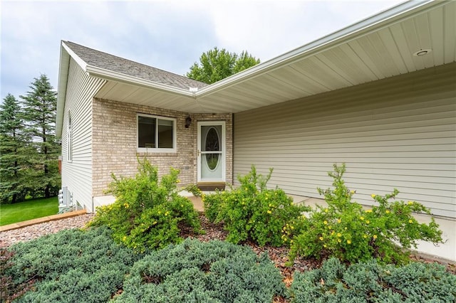 3413 Mcelroy Ct, Eau Claire, WI 54701 - property entrance with brick siding and a shingled roof