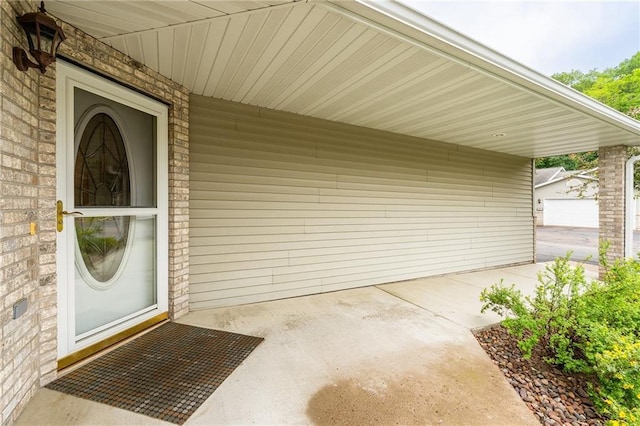 3413 Mcelroy Ct, Eau Claire, WI 54701 - view of exterior entry with an attached carport and brick siding
