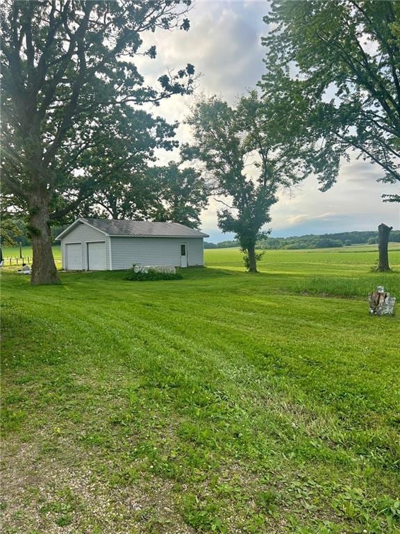 N6894 690th St, Menomonie, WI 54751 - view of green lawn featuring a garage and an outbuilding