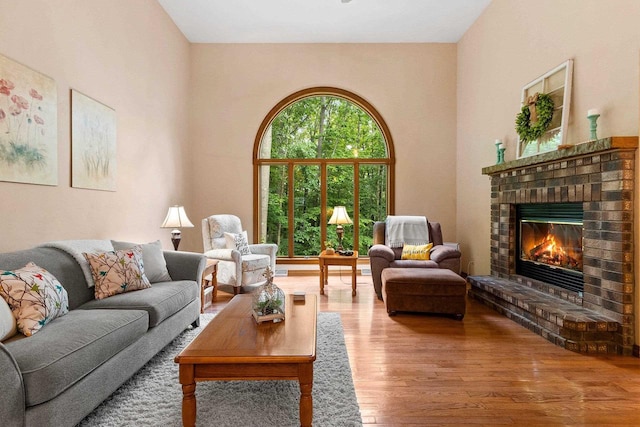 2510 Hillside Heights Dr, Green Bay, WI 54311 - living area featuring wood finished floors and a brick fireplace