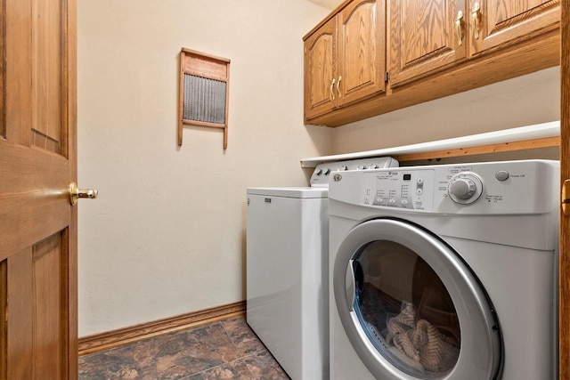 2510 Hillside Heights Dr, Green Bay, WI 54311 - washroom featuring separate washer and dryer, cabinet space, and stone finish flooring