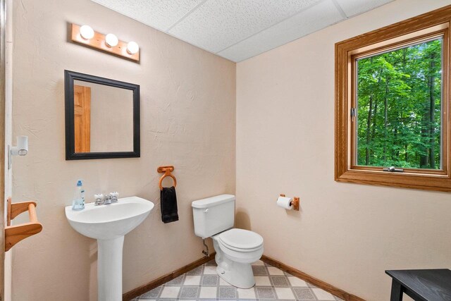 2510 Hillside Heights Dr, Green Bay, WI 54311 - half bath with tile patterned floors and a drop ceiling