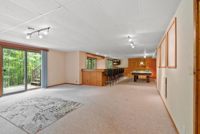 2510 Hillside Heights Dr, Green Bay, WI 54311 - playroom featuring light carpet, track lighting, plenty of natural light, pool table, and wood walls
