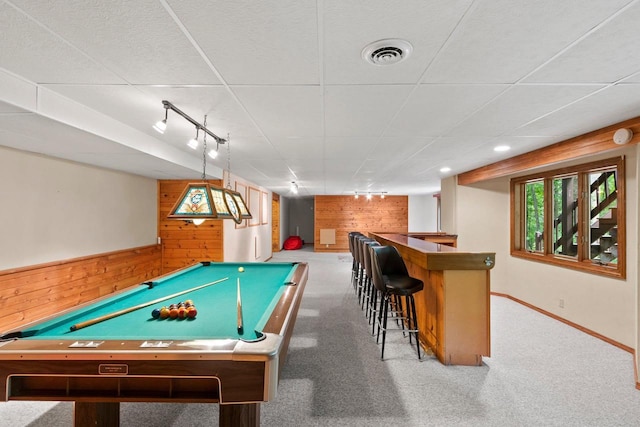 2510 Hillside Heights Dr, Green Bay, WI 54311 - rec room featuring wooden walls, a bar, pool table, carpet floors, and rail lighting