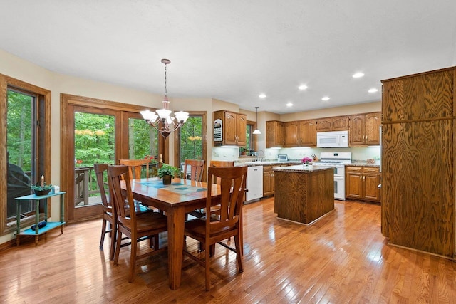 2510 Hillside Heights Dr, Green Bay, WI 54311 - dining area with a chandelier, light wood-type flooring, and recessed lighting