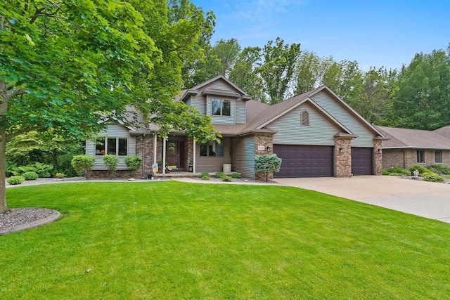 2510 Hillside Heights Dr, Green Bay, WI 54311 - traditional-style home featuring a garage, a front lawn, concrete driveway, and brick siding