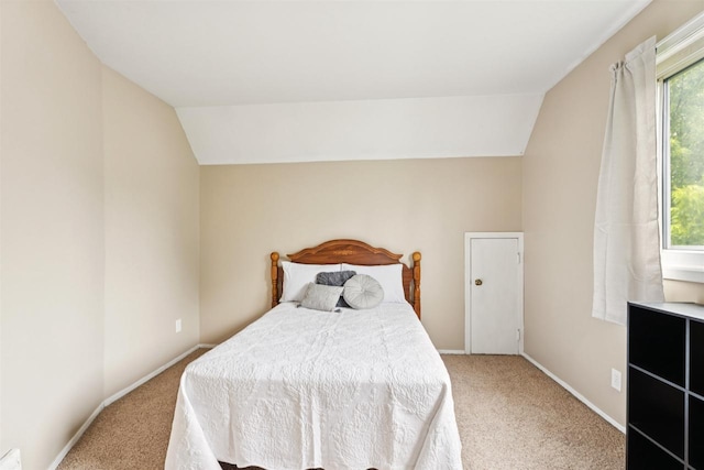 136 Oak St, Brillion, WI 54110 - bedroom with light carpet and vaulted ceiling