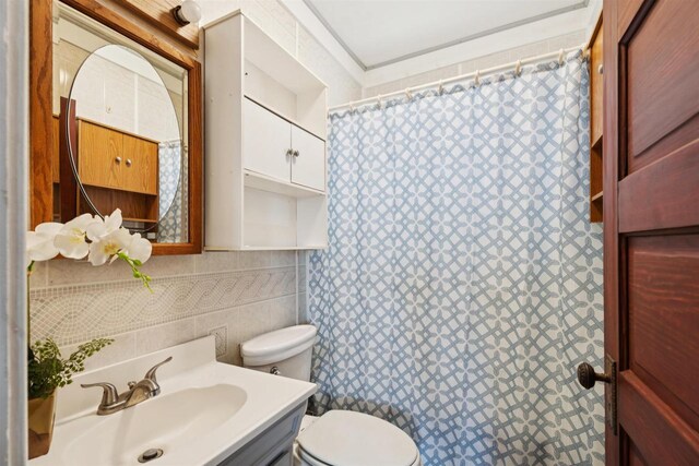 136 Oak St, Brillion, WI 54110 - full bathroom with tile walls, vanity, and a shower with curtain