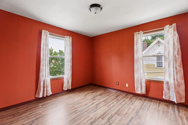 136 Oak St, Brillion, WI 54110 - unfurnished room featuring wood finished floors and baseboards