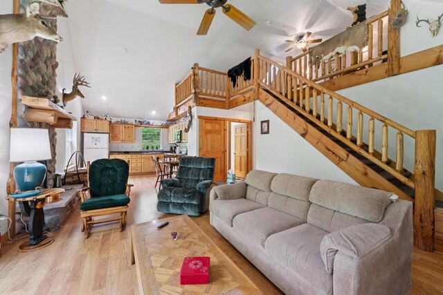 5093 County Highway G, Cavour, WI 54511 - living room with stairway, ceiling fan, recessed lighting, light wood-style flooring, and high vaulted ceiling