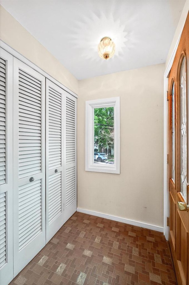 2813 Regent St, Madison, WI 53705 - entryway featuring baseboards and brick patterned floors
