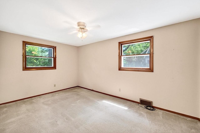 2813 Regent St, Madison, WI 53705 - unfurnished room with plenty of natural light, light colored carpet, and ceiling fan
