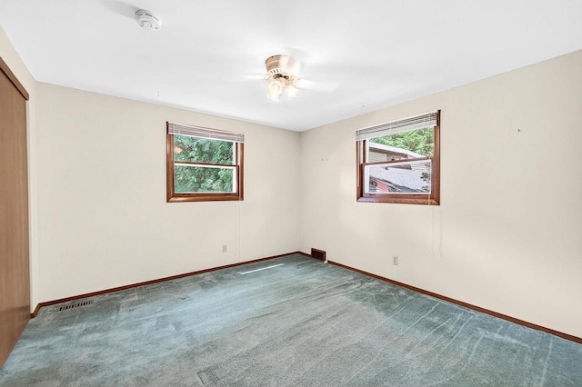 2813 Regent St, Madison, WI 53705 - carpeted spare room with plenty of natural light, ceiling fan, and a smoke detector