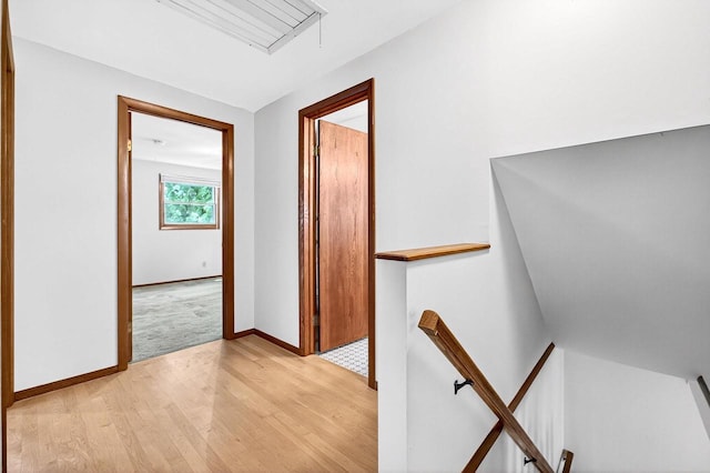 2813 Regent St, Madison, WI 53705 - hallway with an upstairs landing, light wood-style flooring, and attic access