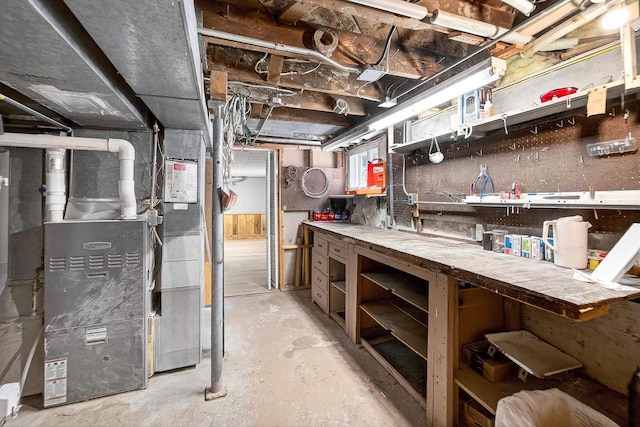 2813 Regent St, Madison, WI 53705 - unfinished basement with a workshop area and heating unit