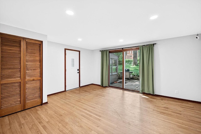 2813 Regent St, Madison, WI 53705 - unfurnished bedroom with access to outside, light wood finished floors, recessed lighting, and a closet