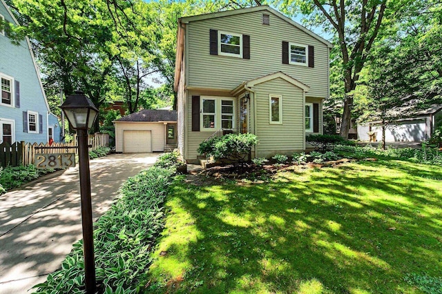 2813 Regent St, Madison, WI 53705 - view of front facade featuring driveway, an outdoor structure, and a garage