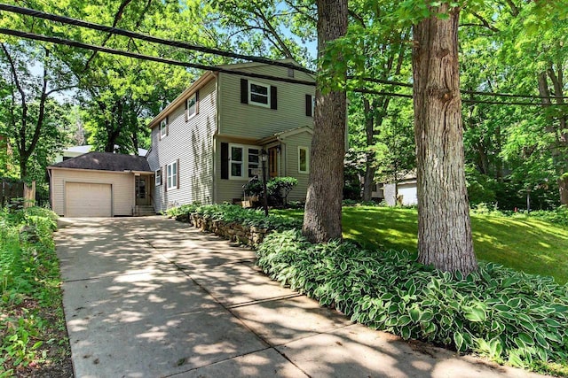 2813 Regent St, Madison, WI 53705 - view of front facade featuring driveway, a garage, and a front lawn