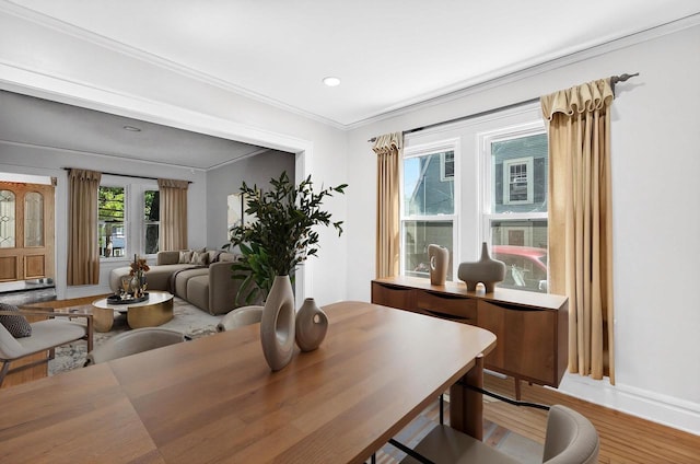 2813 Regent St, Madison, WI 53705 - dining area with light wood-type flooring, recessed lighting, and crown molding