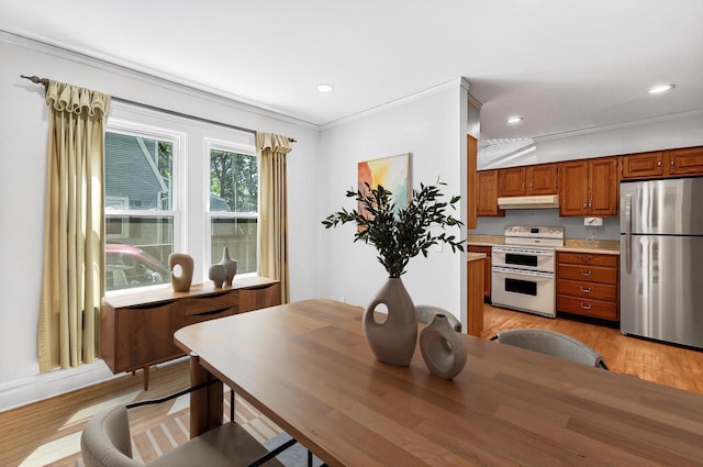 2813 Regent St, Madison, WI 53705 - dining room featuring light wood finished floors, crown molding, and recessed lighting