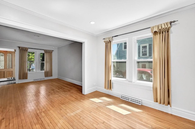 2813 Regent St, Madison, WI 53705 - empty room featuring light wood-type flooring, crown molding, and recessed lighting