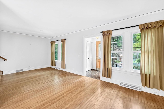 2813 Regent St, Madison, WI 53705 - unfurnished living room featuring light wood-style floors and plenty of natural light