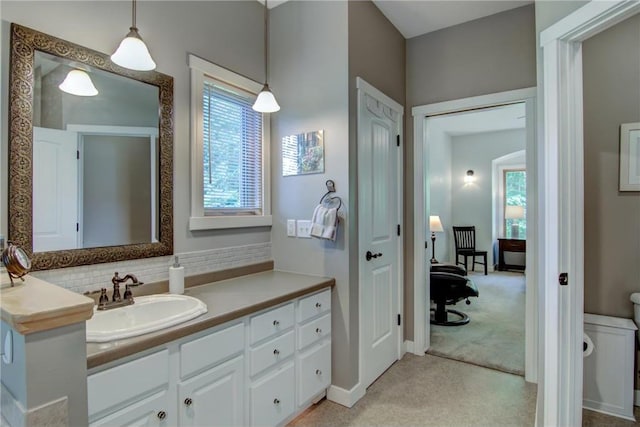 1403 Elm Ave, Menomonie, WI 54751 - bathroom featuring plenty of natural light, vanity, and backsplash